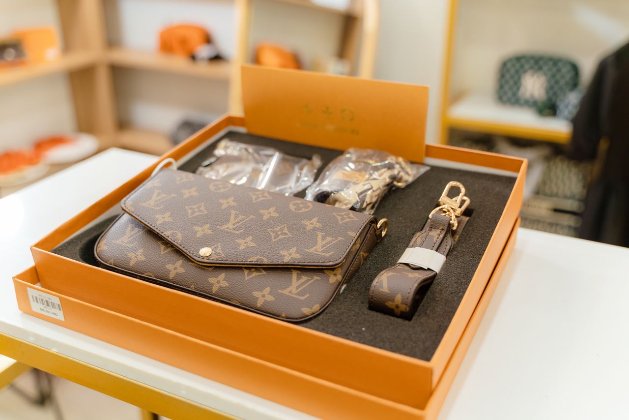 services-03 High-end Louis Vuitton monogram bag set displayed in a luxury boutique.